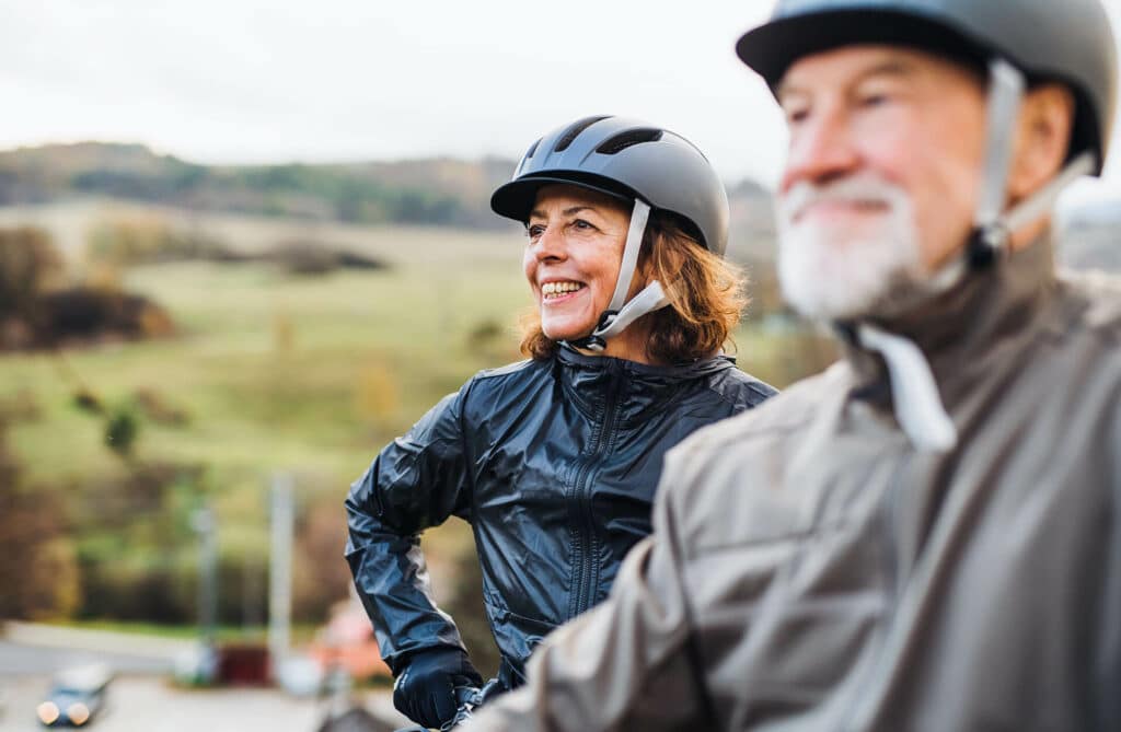 Older couple biking