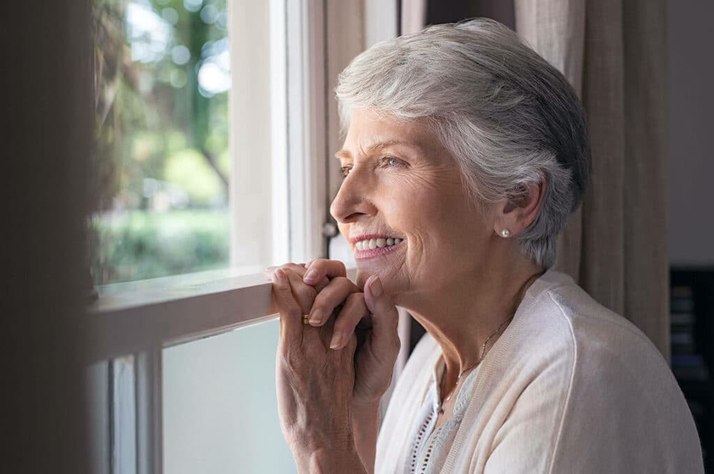 woman looking out window